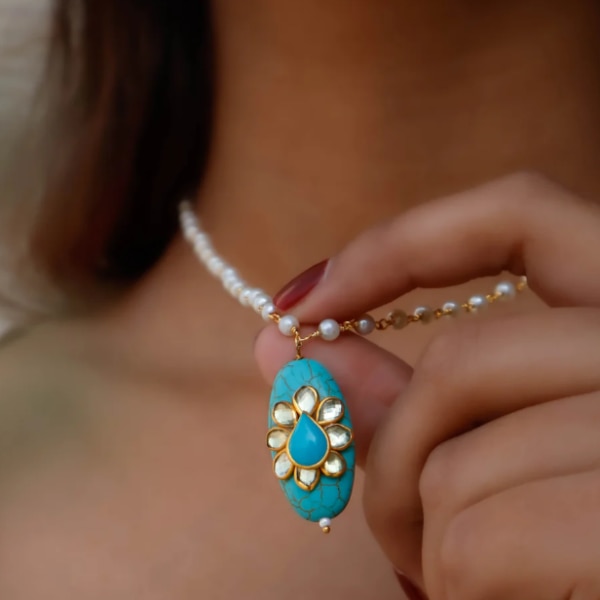 https://akm-img-a-in.tosshub.com/lingo/brt/images/photo_gallery/202604/kaashnii_tessa_turquoise_pendant_necklace_rs2299.png