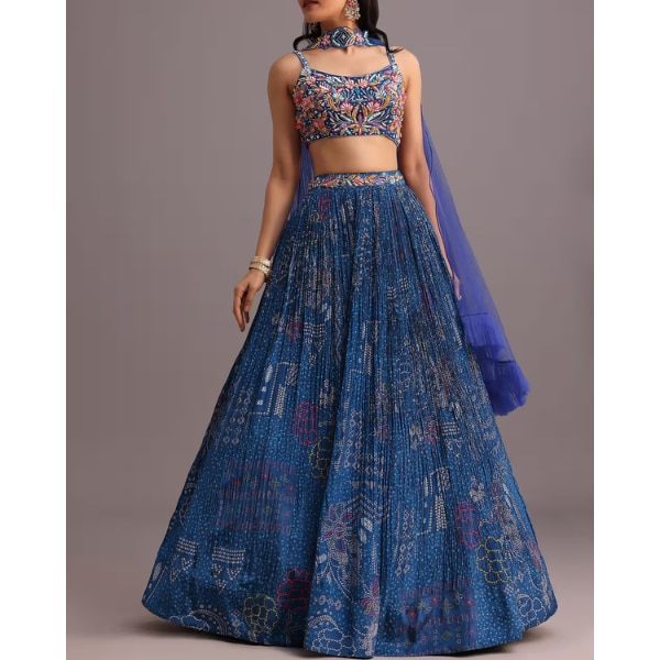 https://akm-img-a-in.tosshub.com/lingo/brt/images/photo_gallery/202604/kalki_blue_hand_embroidered_choli_with_bandhani_print_lehenga_and_choker_net_dupatta_rs22941.png
