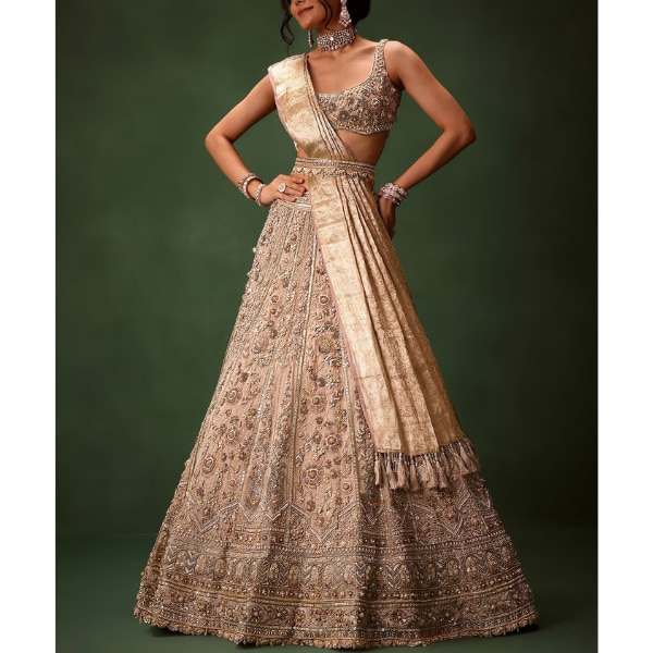 https://akm-img-a-in.tosshub.com/lingo/brt/images/photo_gallery/202604/kalki_gold_beige_chanderi_silk_lehenga_set_with_embroidered_jacket_and_dupatta_rs339950.png
