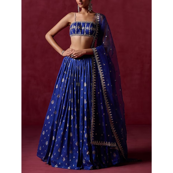 https://akm-img-a-in.tosshub.com/lingo/brt/images/photo_gallery/202604/lashkaraa_royal_blue_brocade_zari_sequins_embroidered_lehenga_set_rs15800.png