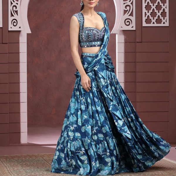 https://akm-img-a-in.tosshub.com/lingo/brt/images/photo_gallery/202604/roopkala_cobalt_blue_printed_lehenga_set_in_modal_satin_rs31500.png