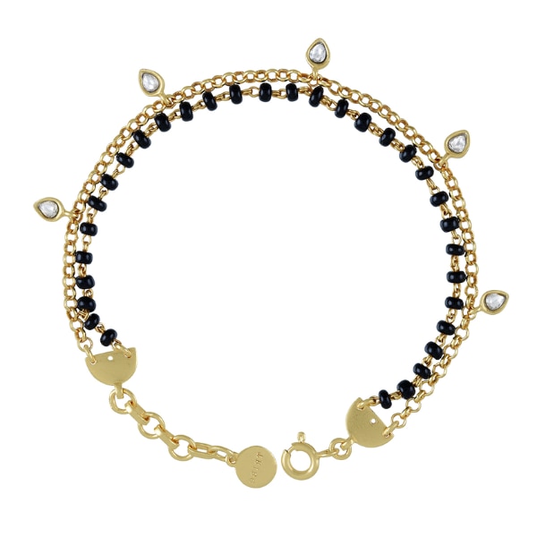 https://akm-img-a-in.tosshub.com/lingo/brt/images/photo_gallery/202604/tribe_amrapali_gold_plated_silver_advaita_mangalsutra_bracelet_rs4326.png