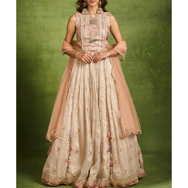 https://akm-img-a-in.tosshub.com/lingo/brt/images/photo_gallery/202604/twamev_elegant_cream_chanderi_lehenga_rs37999.png