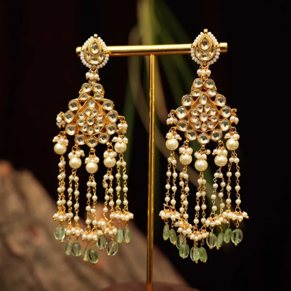 https://akm-img-a-in.tosshub.com/lingo/brt/images/photo_gallery/202605/rimli_riva_polki_tassel_earrings_rs5500.png