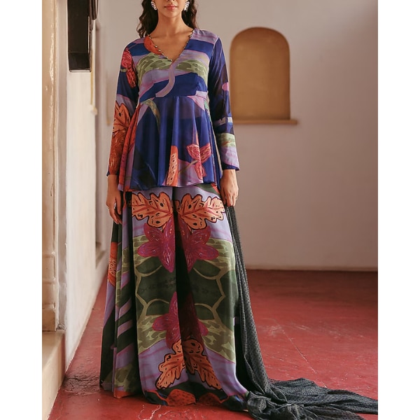 https://akm-img-a-in.tosshub.com/lingo/brt/images/photo_gallery/202605/zip_by_payal_zinal_blue_georgette_printed_sharara_set_rs13350.png