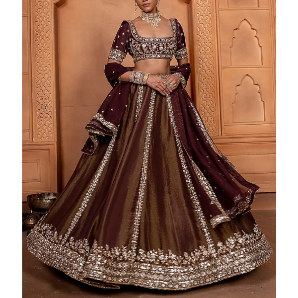 https://akm-img-a-in.tosshub.com/lingo/brt/images/photo_gallery/202606/enamour_by_radha_deep_maroonish_brown_zari_silk_upada_silk_sequins_embellished_lehenga_set_rs96500.png