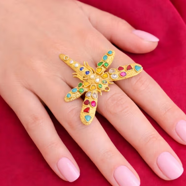 https://akm-img-a-in.tosshub.com/lingo/brt/images/photo_gallery/202606/kalki_multicolor_mother_of_pearl_ring_rs3100.png