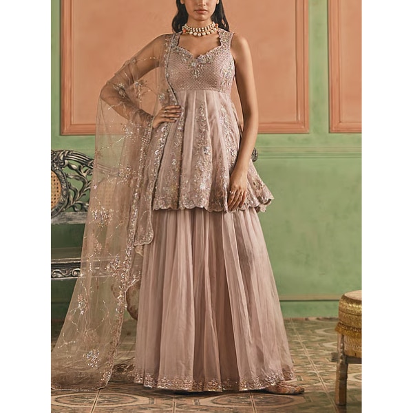 https://akm-img-a-in.tosshub.com/lingo/brt/images/photo_gallery/202606/lashkaraa_pink_organza_zari_peplum_kurta_sharara_set_rs13500.png