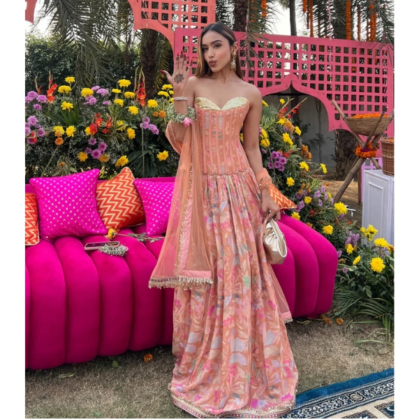 https://akm-img-a-in.tosshub.com/lingo/brt/images/photo_gallery/202606/old_marigold_alina_peach_sequinned_corset_muslin_lehenga_set_rs25500.png