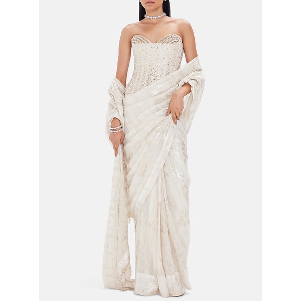 https://akm-img-a-in.tosshub.com/lingo/brt/images/photo_gallery/202607/basanti-kapde_aur_koffee_ivory_georgette_saree_set_rs35990.png