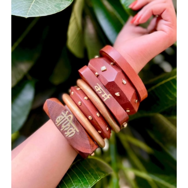 https://akm-img-a-in.tosshub.com/lingo/brt/images/photo_gallery/202607/bloom_wooden_bracelet_kada_set_rs4999.png