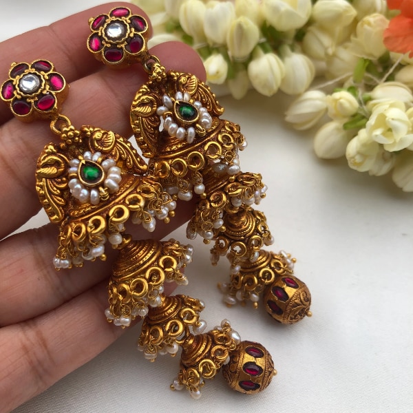 https://akm-img-a-in.tosshub.com/lingo/brt/images/photo_gallery/202607/house_of_taamara_4_layered_jhumkas_with_antique_kundan_bead_drop_rs24600.png