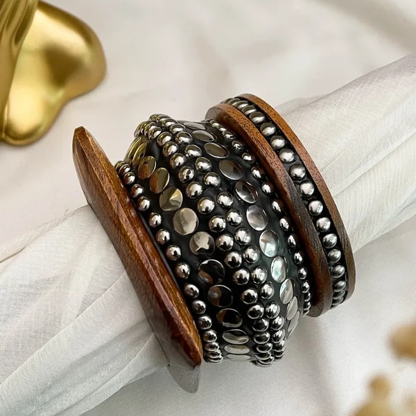 https://akm-img-a-in.tosshub.com/lingo/brt/images/photo_gallery/202607/ishhaara_stack_of_3_embossed_wooden_bangle_rs4550.png