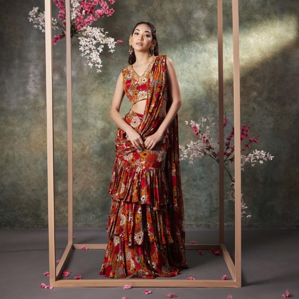 https://akm-img-a-in.tosshub.com/lingo/brt/images/photo_gallery/202607/mehak_murpana_orange_printed_choli_and_pre_draped_ruffle_saree_set_rs42294.png