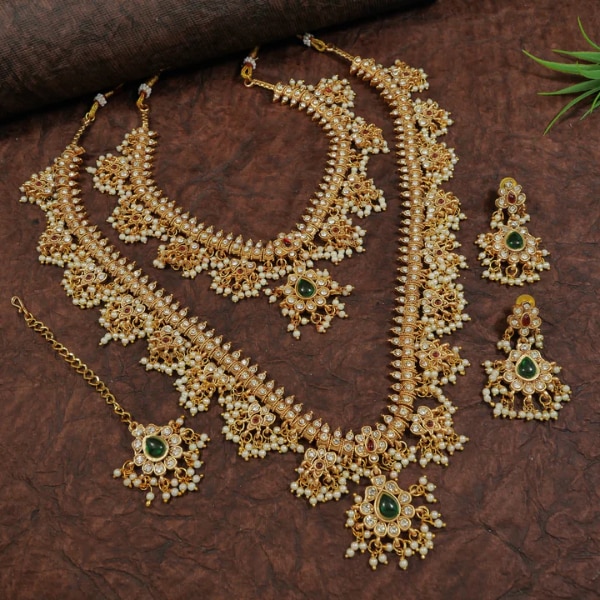 https://akm-img-a-in.tosshub.com/lingo/brt/images/photo_gallery/202607/orna_traditional_gold_plated_combo_bridal_necklace_set_rs4898.png