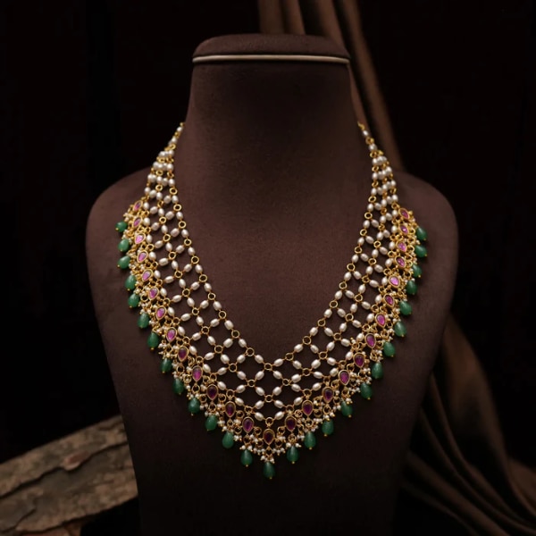 https://akm-img-a-in.tosshub.com/lingo/brt/images/photo_gallery/202607/rimli_chandana_pearl_polki_necklace_rs5800.png