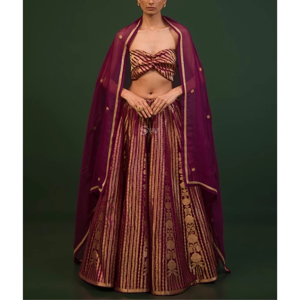 https://akm-img-a-in.tosshub.com/lingo/brt/images/photo_gallery/202607/sacred_weaves_dark_purple_satin_silk_handloom_banarasi_lehenga_rs74000.png