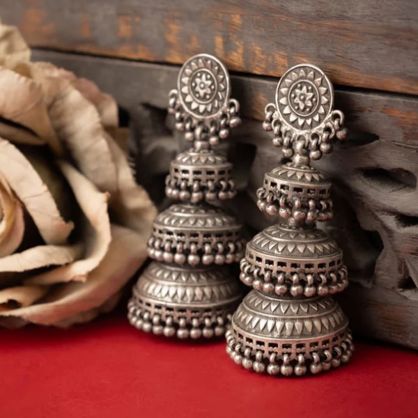 https://akm-img-a-in.tosshub.com/lingo/brt/images/photo_gallery/202607/shyle_tattva_intricate_triple_layer_jhumka_rs29500.png