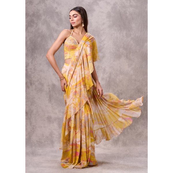 https://akm-img-a-in.tosshub.com/lingo/brt/images/photo_gallery/202607/twamev_yellow_pink_georgette_floral_printed_ruffle_corset_draped_saree_rs26999.png