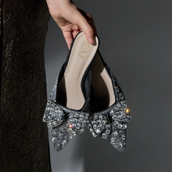 https://akm-img-a-in.tosshub.com/lingo/brt/images/photo_gallery/202608/cai_sparkly_black_mule_heels_rs5599.png