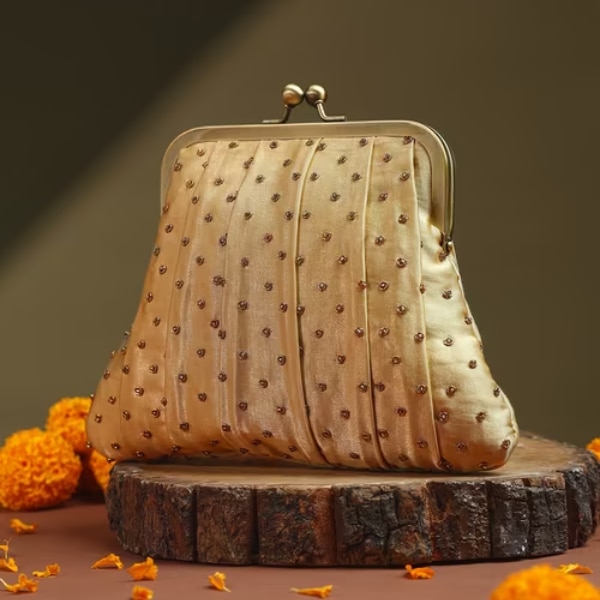 https://akm-img-a-in.tosshub.com/lingo/brt/images/photo_gallery/202608/fabindia_golden_embroidered_clutch_rs2499.png