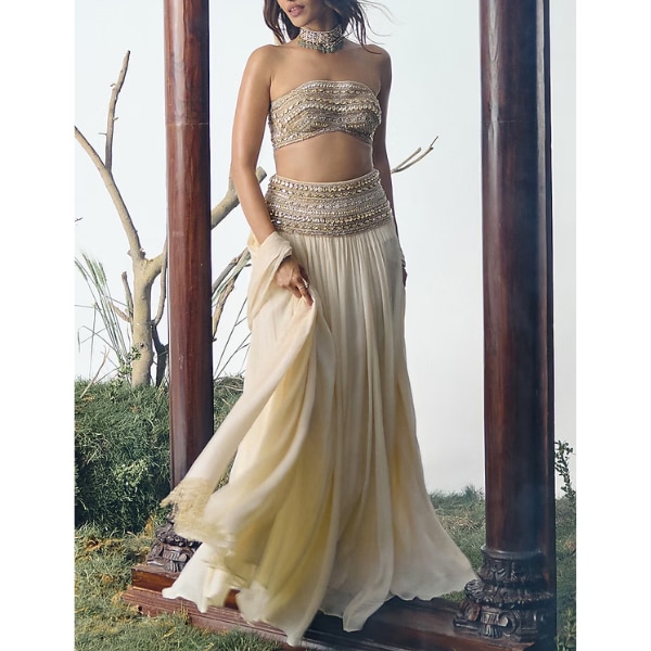 https://akm-img-a-in.tosshub.com/lingo/brt/images/photo_gallery/202608/house_of_arshiyaa_ivory_chiffon_sequin_embellished_lehenga_set_rs65000.png