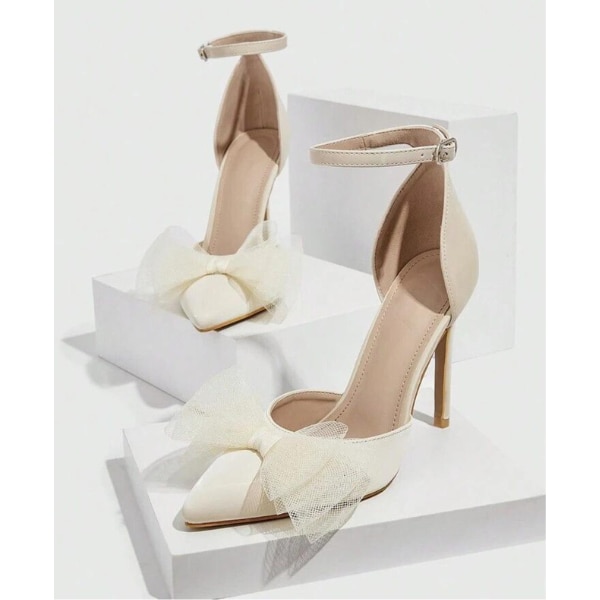 https://akm-img-a-in.tosshub.com/lingo/brt/images/photo_gallery/202608/lavie_party_stiletto_pumps_with_bows_rs2999.png