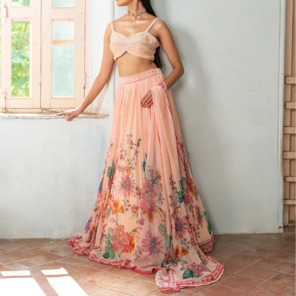 https://akm-img-a-in.tosshub.com/lingo/brt/images/photo_gallery/202608/mohi_fashion_whimsy_wildflower_peach_lehenga_rs34000.png