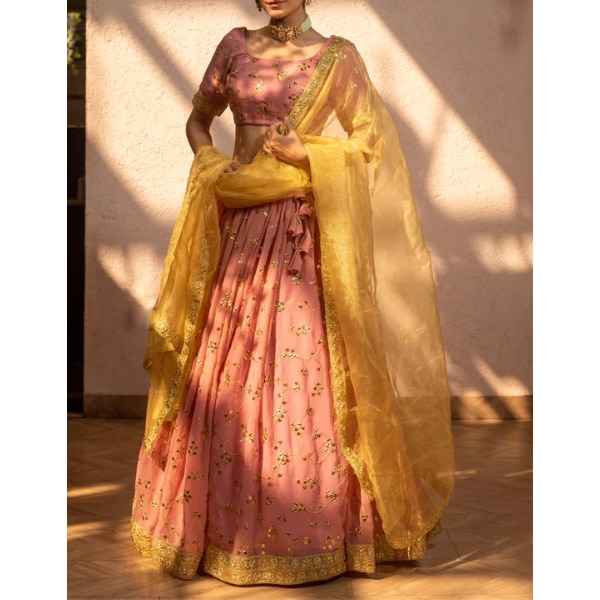 https://akm-img-a-in.tosshub.com/lingo/brt/images/photo_gallery/202608/sarnya_gold_peach_lehenga_rs11590.png