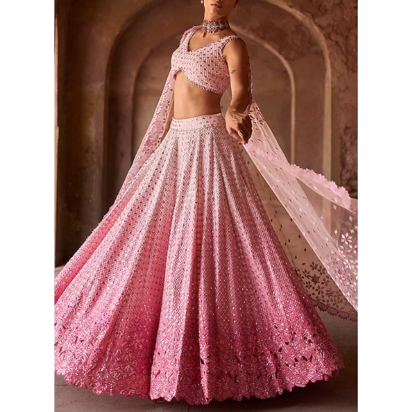 https://akm-img-a-in.tosshub.com/lingo/brt/images/photo_gallery/202608/sawan_gandhi_pink_ombre_chiffon_mirror_embroidered_lehenga_set_rs288000.png