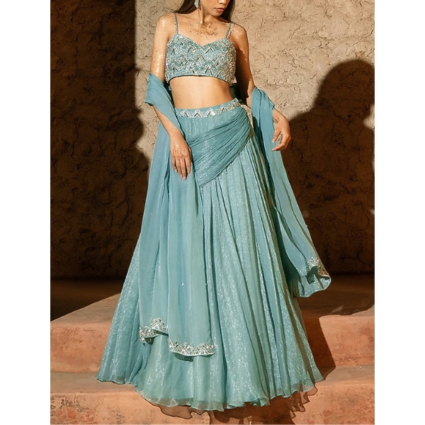 https://akm-img-a-in.tosshub.com/lingo/brt/images/photo_gallery/202608/silky_bindra_aqua_blue_shimmer_chiffon_cowl_lehenga_set_rs45000.png