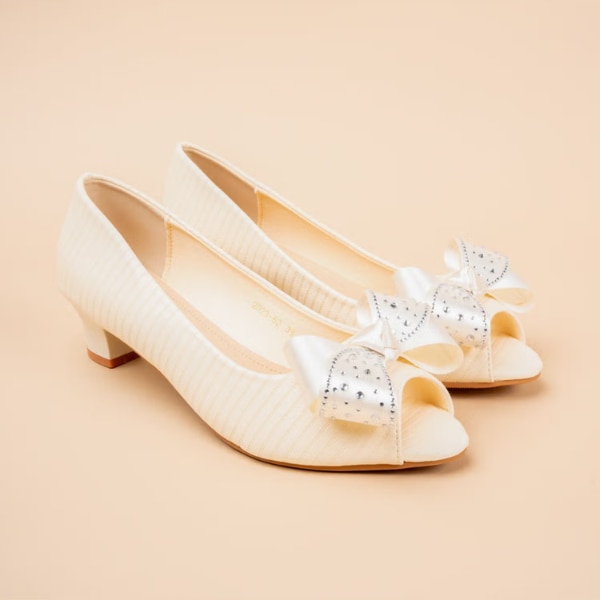 https://akm-img-a-in.tosshub.com/lingo/brt/images/photo_gallery/202608/vanson_velour_bow_cream_kitten_heel_sandal_rs2490.png