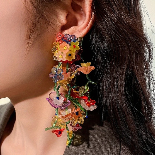 https://akm-img-a-in.tosshub.com/lingo/brt/images/photo_gallery/202609/bling_queen_flower_vine_dangle_earrings_rs2299.png