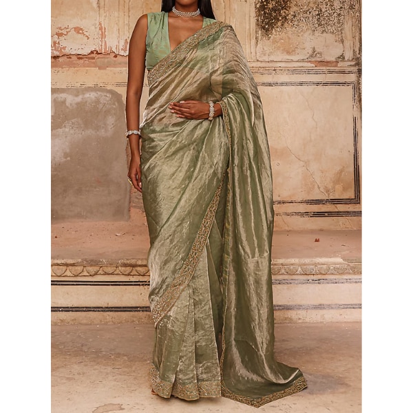 https://akm-img-a-in.tosshub.com/lingo/brt/images/photo_gallery/202609/charu_makkar_sage_green_tissue_dori_work_saree_set_rs42900.png