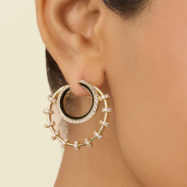 https://akm-img-a-in.tosshub.com/lingo/brt/images/photo_gallery/202609/isharya_tanguya_double_hoops_in_18kt_gold_plated_rs4799.png