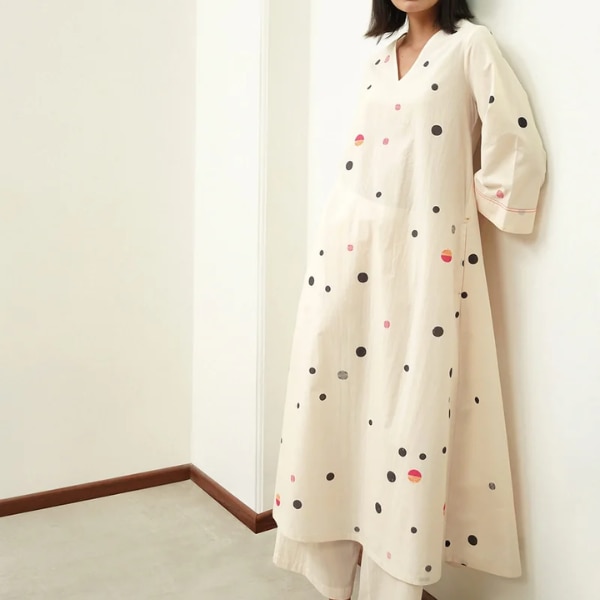 https://akm-img-a-in.tosshub.com/lingo/brt/images/photo_gallery/202609/pink_fort_cotton_polka_a-line_kurta_set_rs4495.png
