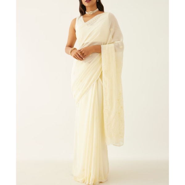 https://akm-img-a-in.tosshub.com/lingo/brt/images/photo_gallery/202609/taneira_light_yellow_pure_silk_georgette_lucknow_chikankari_saree_rs9999.png