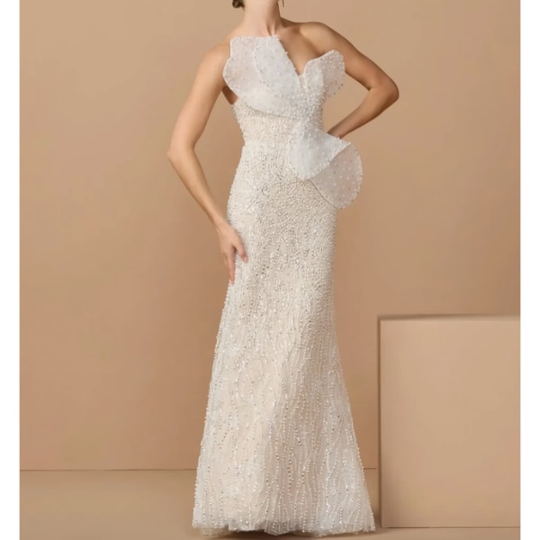 https://akm-img-a-in.tosshub.com/lingo/brt/images/photo_gallery/202610/mac_duggal_ivory_nude_strapless_embellished_column_gown_with_3d_petals_rs175300.png