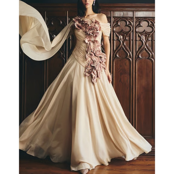 https://akm-img-a-in.tosshub.com/lingo/brt/images/photo_gallery/202610/supria_munjal_beige_organza_applique_petal_work_gown_rs159000.png