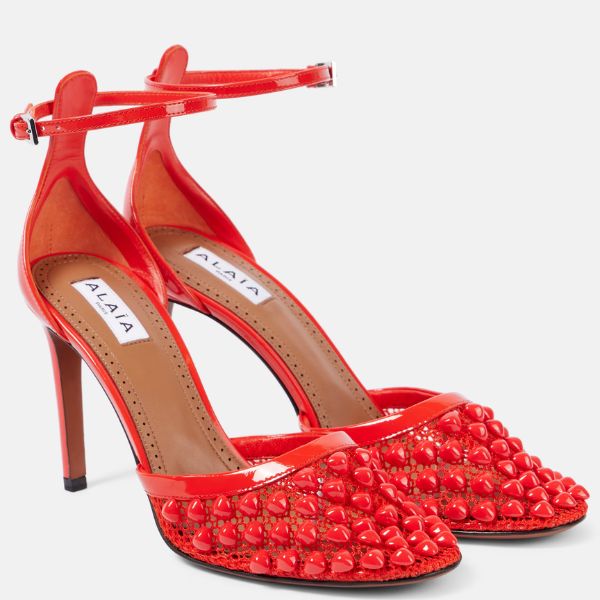 Alaïa Studded Mesh and Leather Pumps ₹1,08,197 approx.