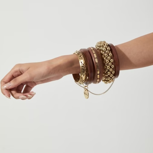 Ritika Sachdeva Golden Stack Mix With Wooden Bangles & Bracelet, ₹3,500
