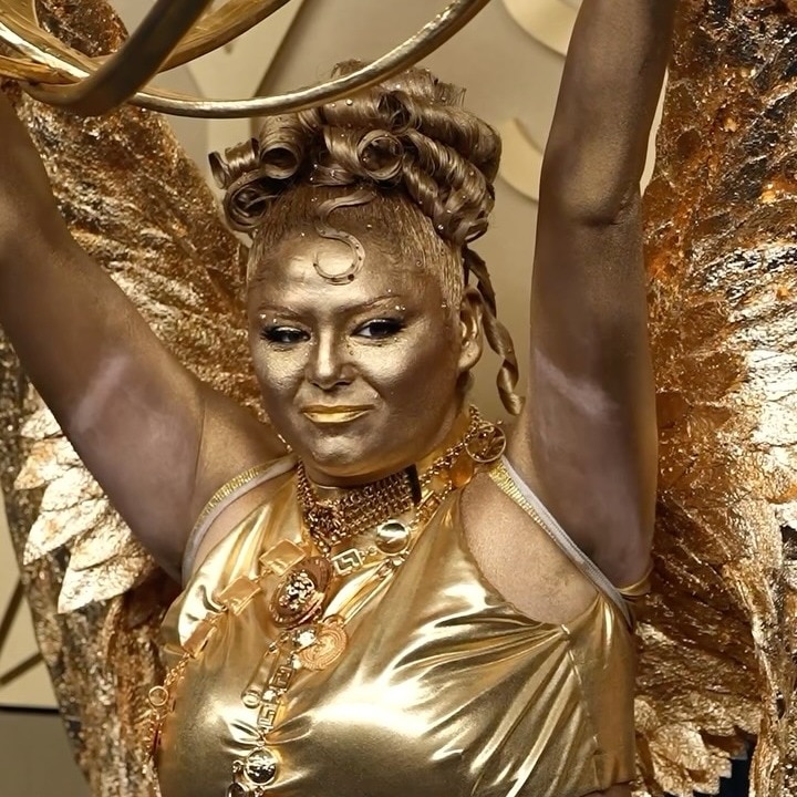 From head to toe, Megan Stalter was serving gold, glam and one very literal awards-season reference
