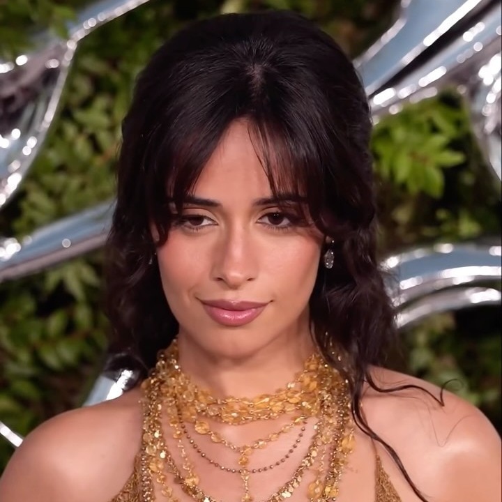 Camila Cabello brought a sultry edge to the naked-dress trend in a gold mesh gown