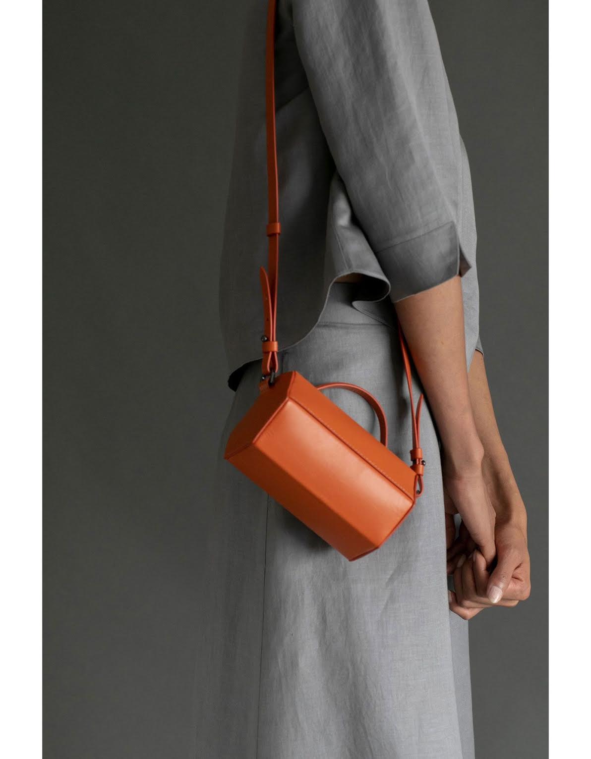  16) Perona, Yui Rust Orange Cross Body Bag, ₹8,000