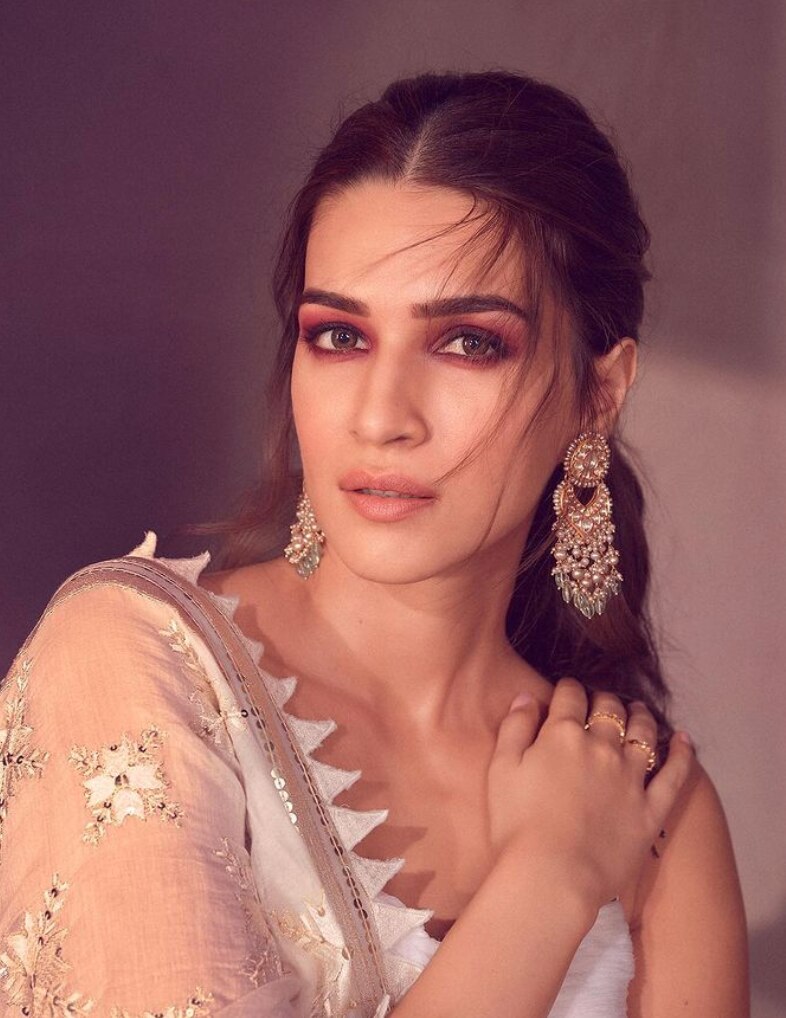 8. A Low Ponytail With Tendrils 8. A Low Ponytail With Tendrils