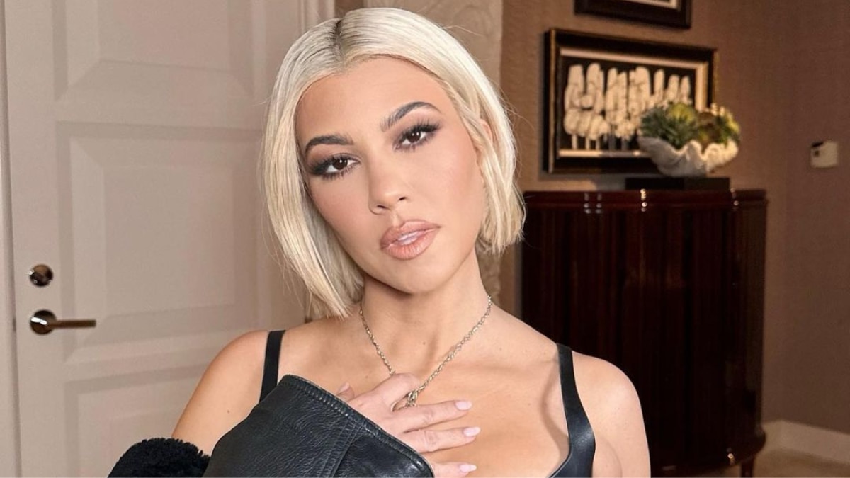 Kourtney Kardashian wears a lace naked dress and high-cut lingerie