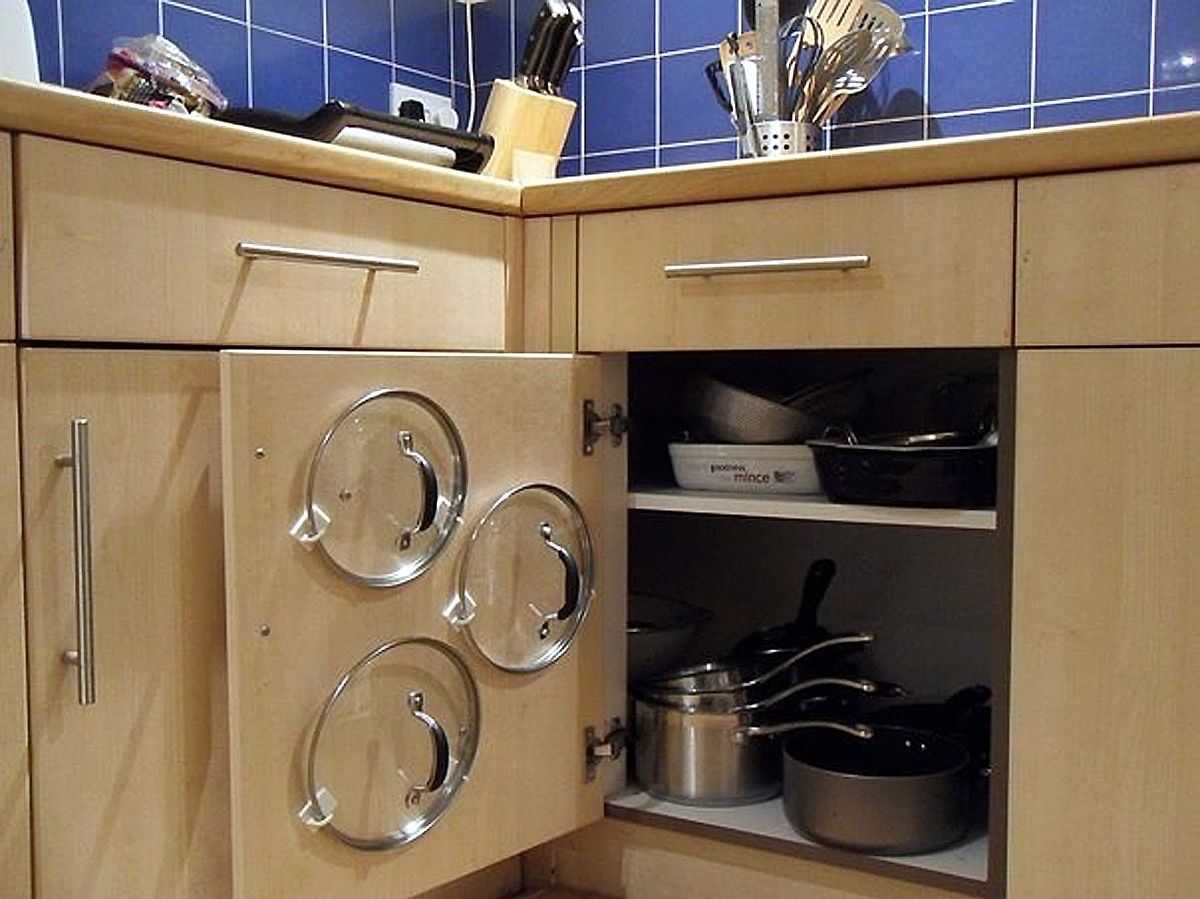 Float Pot Lids on a Cabinet Door Float Pot Lids on a Cabinet Door