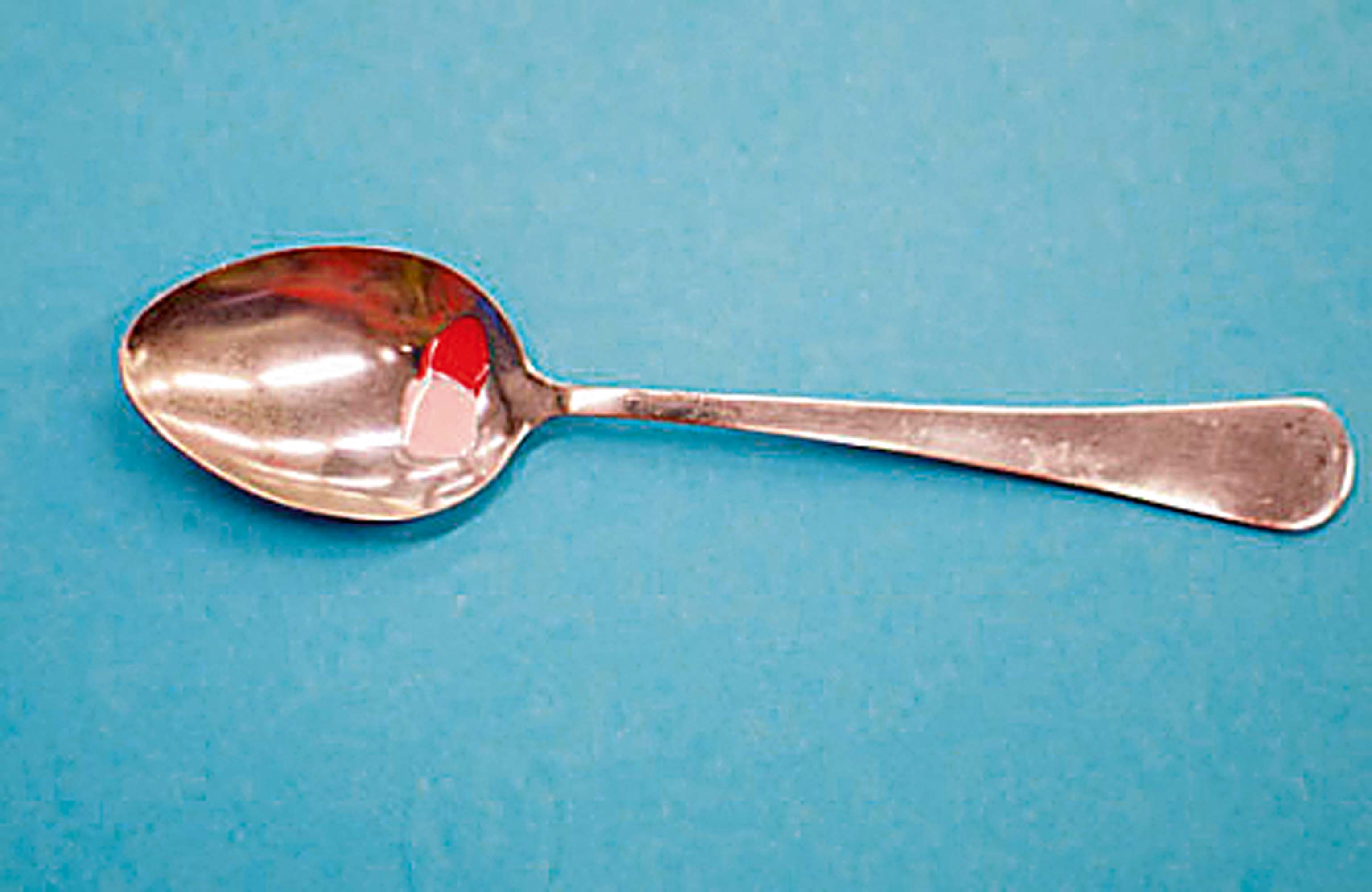 Use the cup of a spoon as a palette for nail art projects