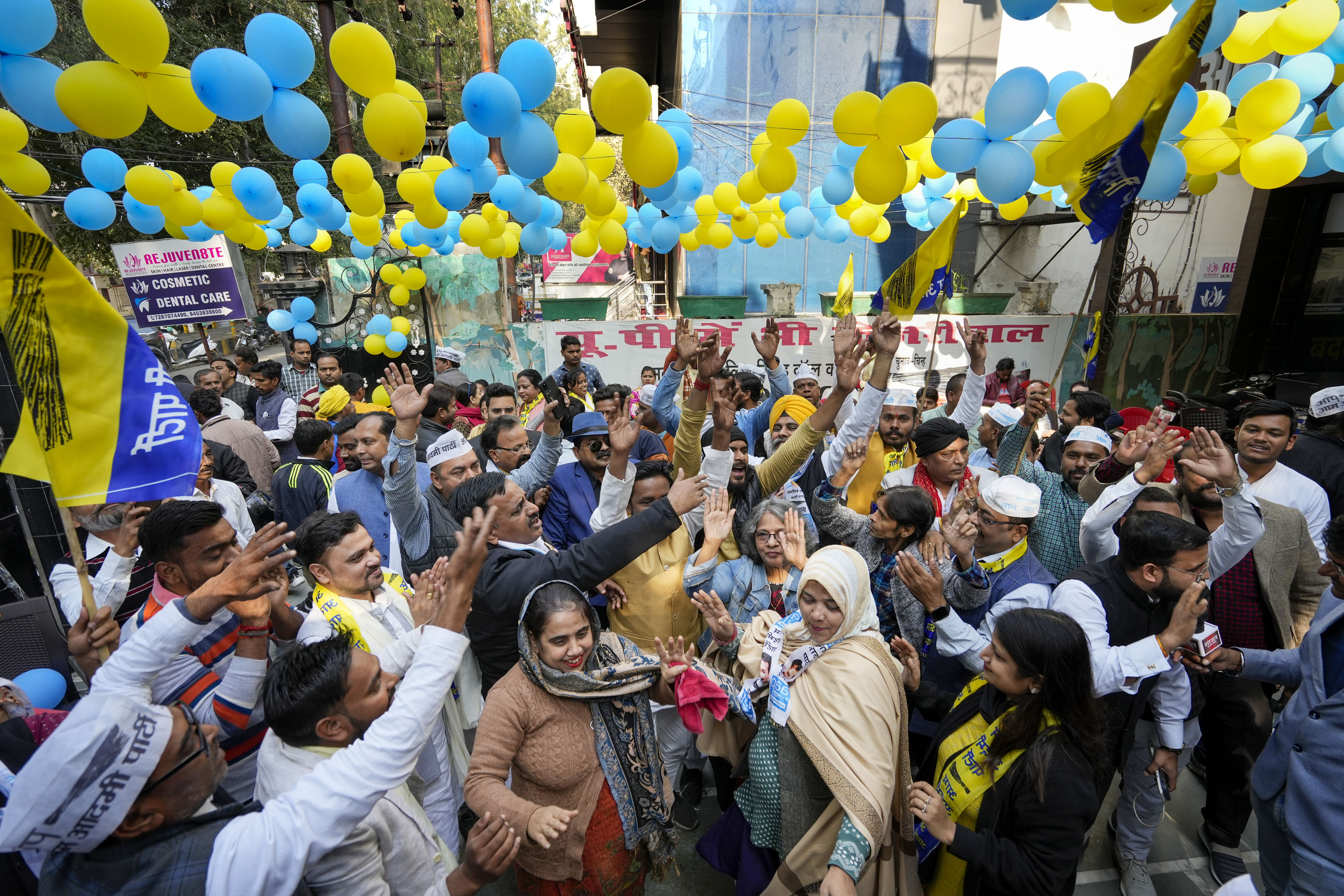 Aam Admi Party workers celebrate in Lucknow