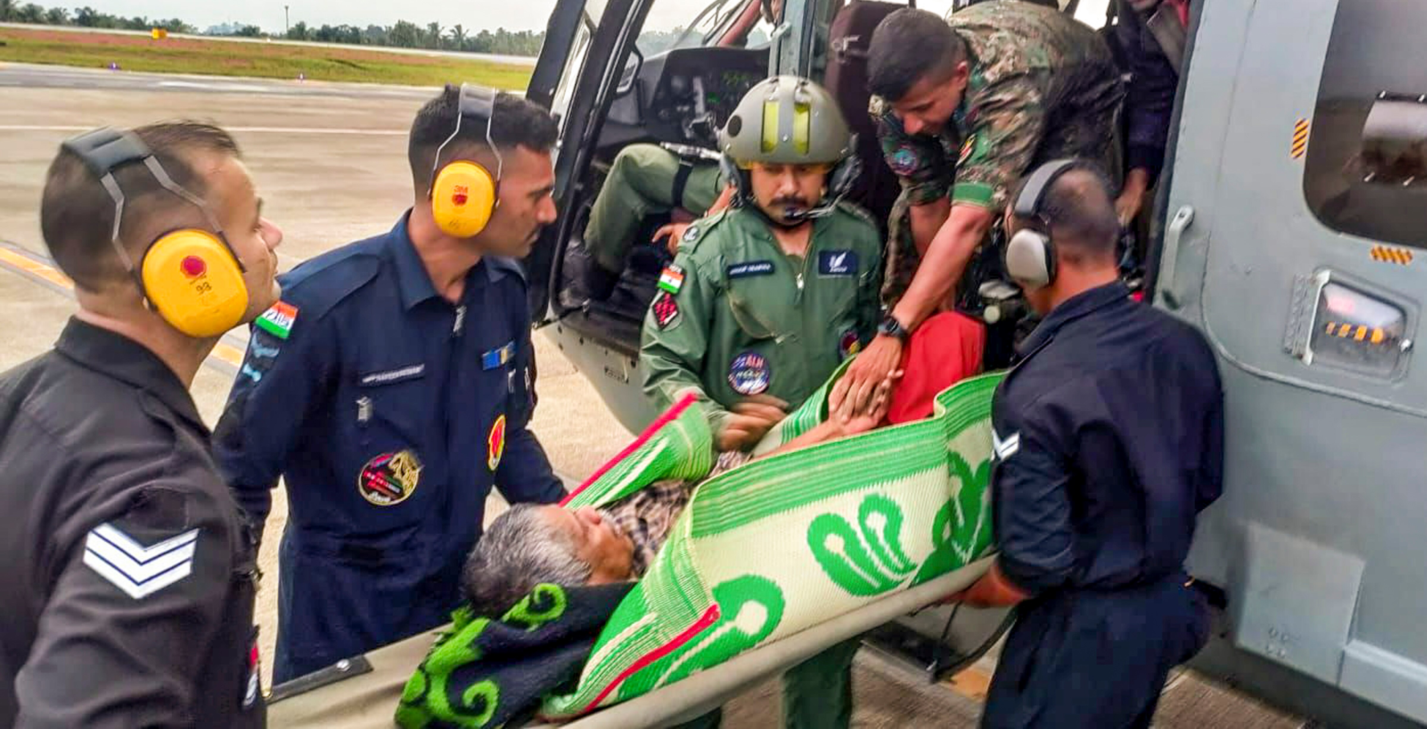 An injured being carried during a rescue operation after a landslide triggered(PTI Photo) An injured being carried during a rescue operation after a landslide triggered(PTI Photo)